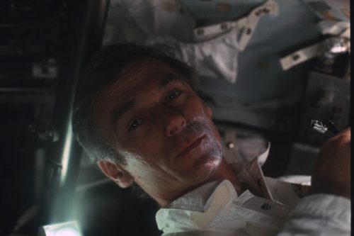 Gene Cernan spruces himself up on the way to the Moon. Credit: NASA